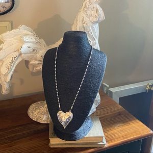 A gorgeous hammered metal signature piece of jewelry!